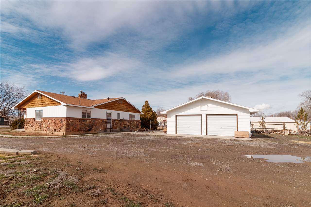 234-28 28 1/2 Road Grand Junction, CO 81503 - Photo 18 of 18 a front view of a house with a yard