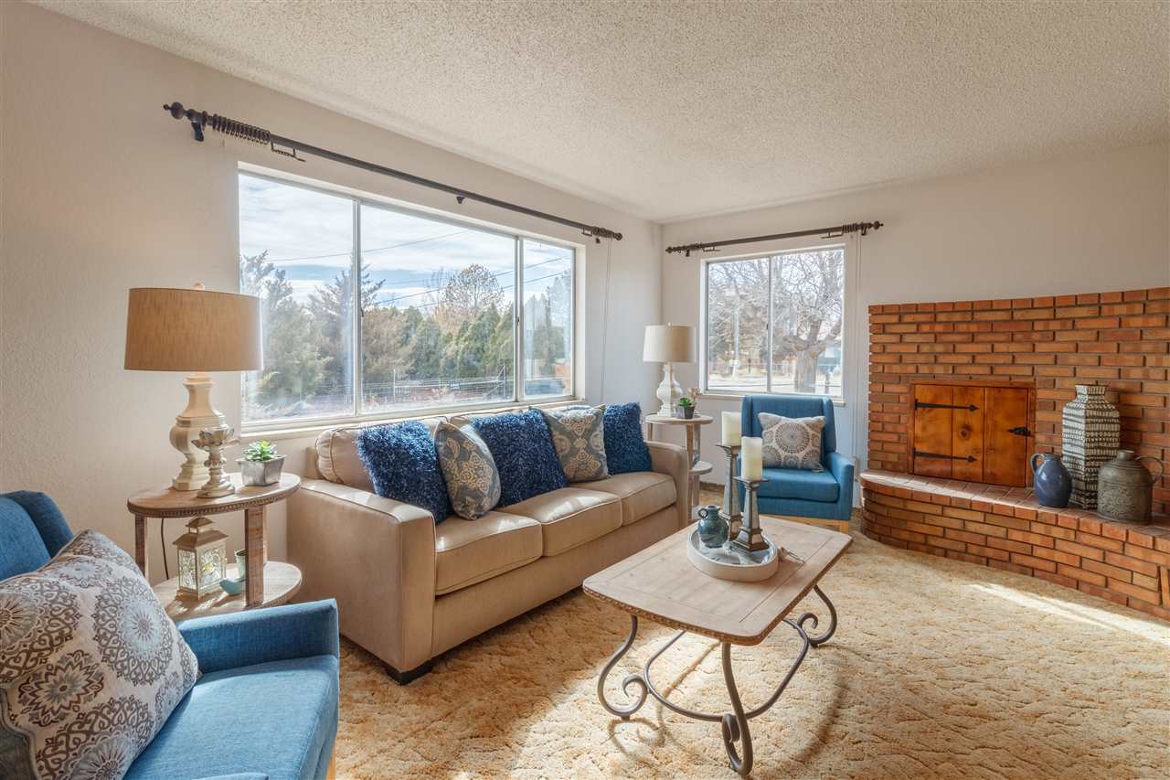 234-28 28 1/2 Road Grand Junction, CO 81503 - Photo 4 of 18 a living room with furniture and a fireplace