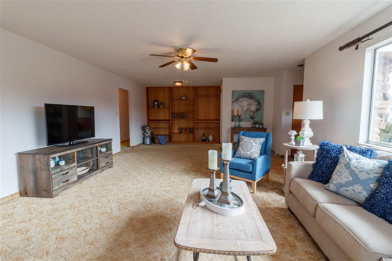 234-28 28 1/2 Road Grand Junction, CO 81503 - Photo 6 of 18 a living room with furniture and a flat screen tv