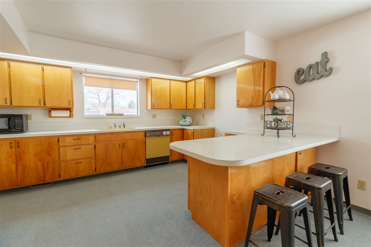 234-28 28 1/2 Road Grand Junction, CO 81503 - Photo 8 of 18 a kitchen with a sink a window and cabinets