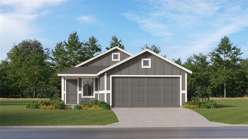 View of front of property featuring board and batten siding, driveway, a garage, and a front yard