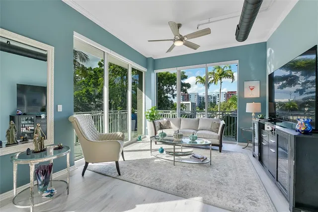 a living room with furniture and a large window