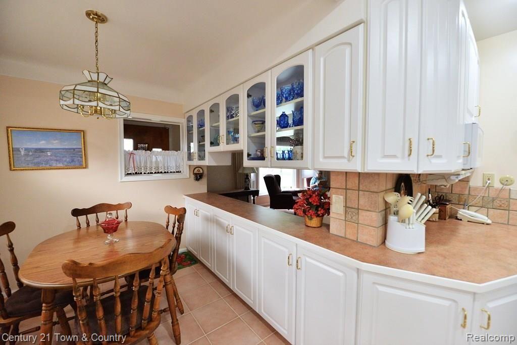 3421 Chester Road Royal Oak, MI 48073 - Photo 5 of 36 Cabinetry wraps around dining area