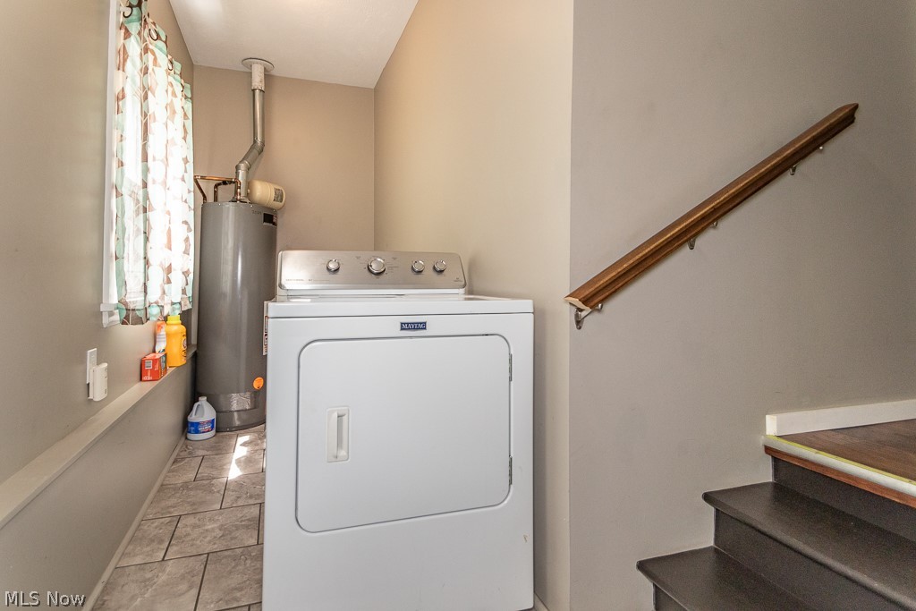 38488 Bell Road Willoughby, OH 44094 - Photo 19 of 22 Laundry area featuring light tile patterned flooring, washer / dryer, and gas water heater