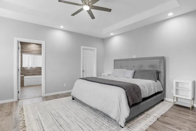 a large white bed in a white room