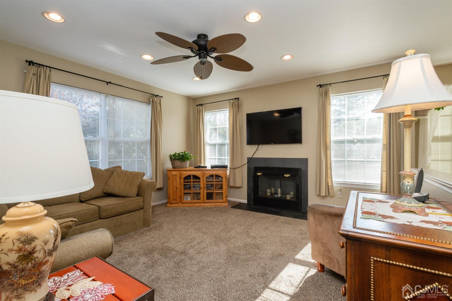 508 Grandview Street Middlesex, NJ 08846 - Photo 11 of 20 a living room with furniture a fireplace and a flat screen tv