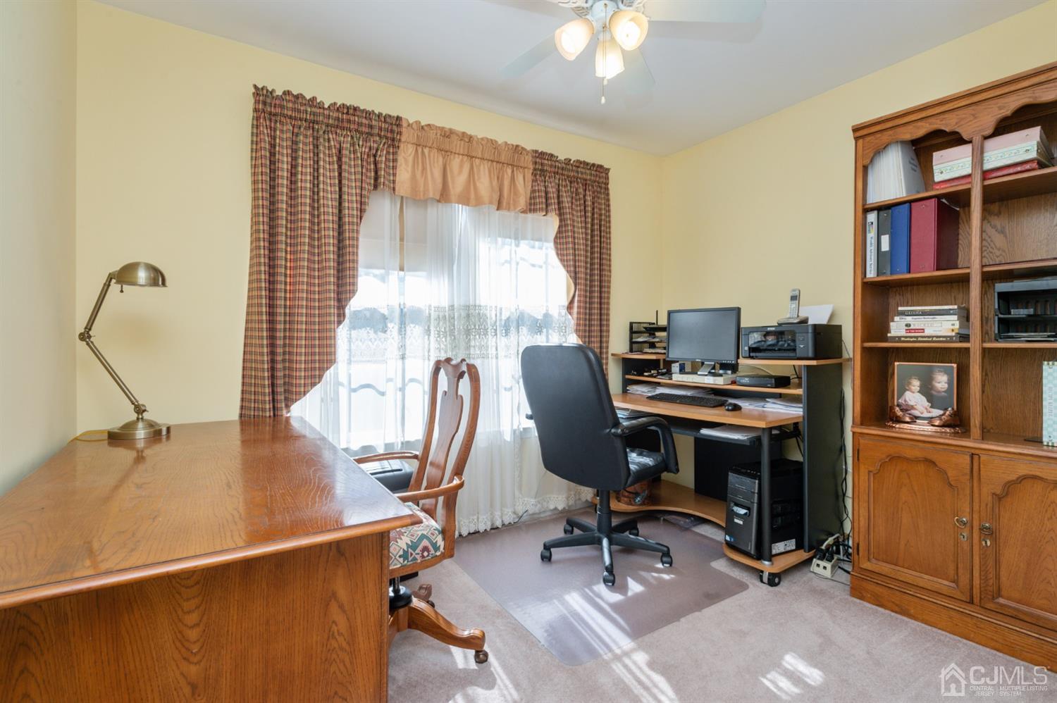 508 Grandview Street Middlesex, NJ 08846 - Photo 17 of 20 a view of a workspace with furniture and a window