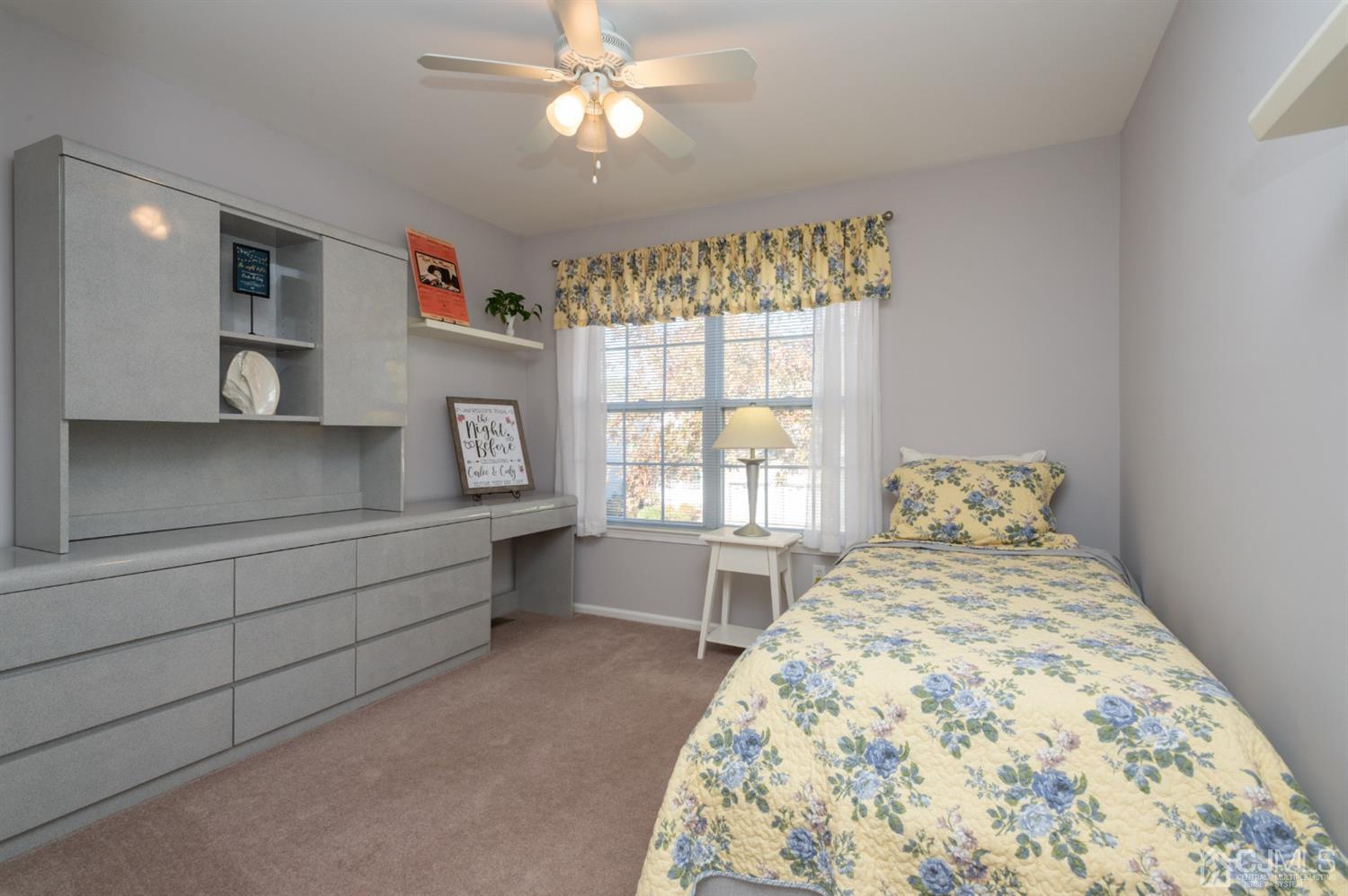 508 Grandview Street Middlesex, NJ 08846 - Photo 18 of 20 a spacious bedroom with a bed and a chandelier