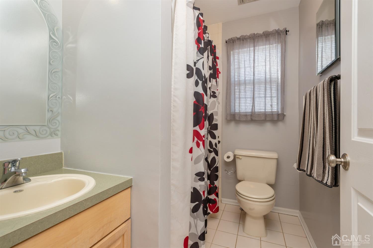 508 Grandview Street Middlesex, NJ 08846 - Photo 19 of 20 a white toilet sitting next to a bathroom sink