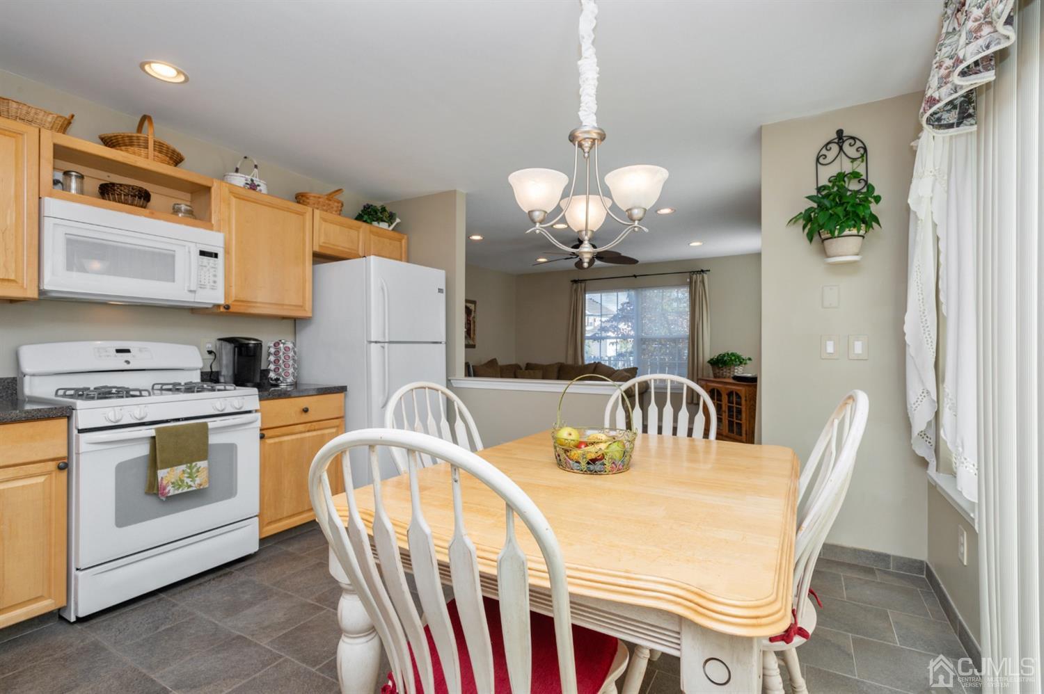 508 Grandview Street Middlesex, NJ 08846 - Photo 3 of 20 a kitchen with stainless steel appliances granite countertop a kitchen island a stove a table and chairs