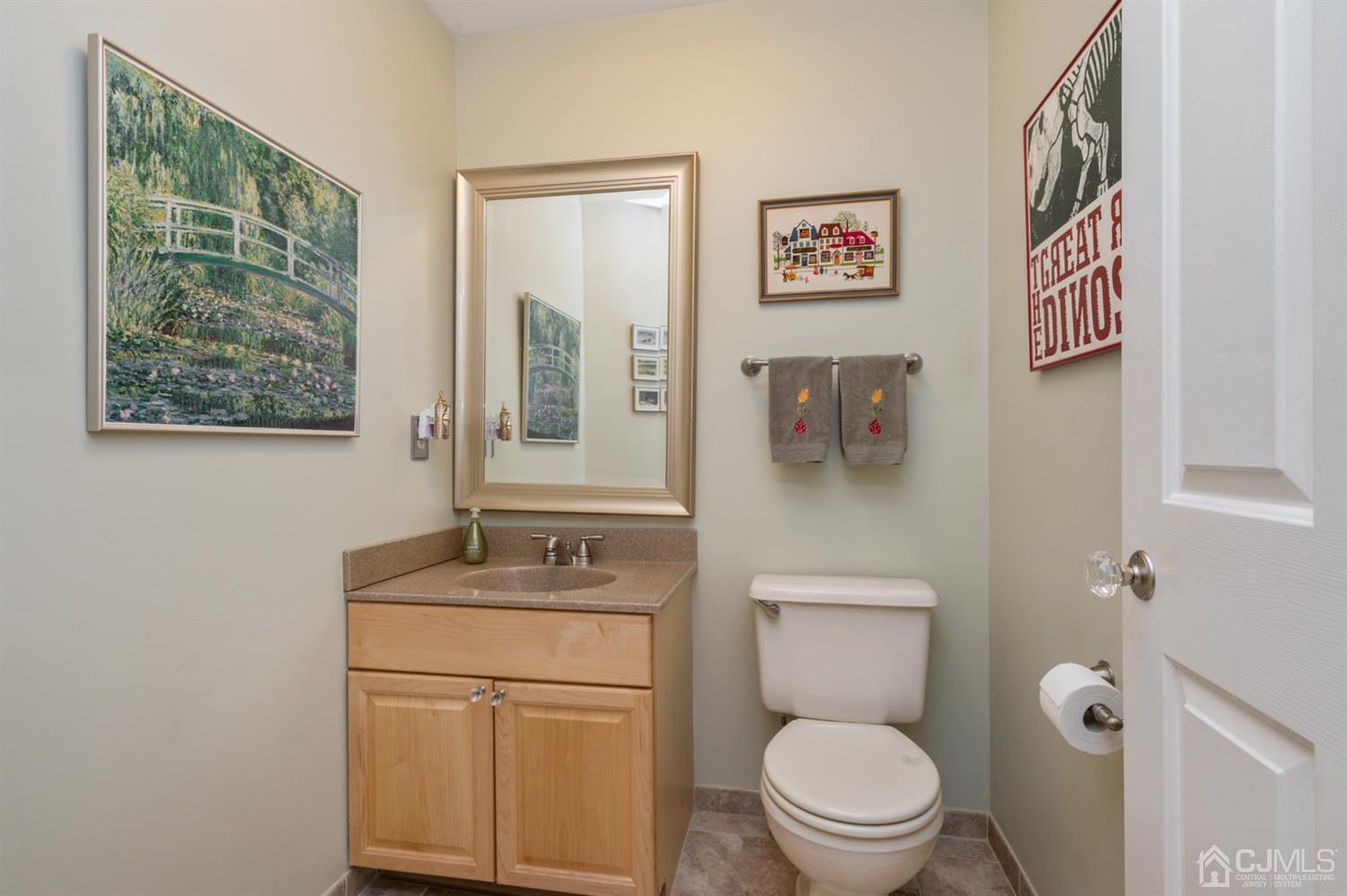 508 Grandview Street Middlesex, NJ 08846 - Photo 9 of 20 a bathroom with a toilet a sink and a mirror