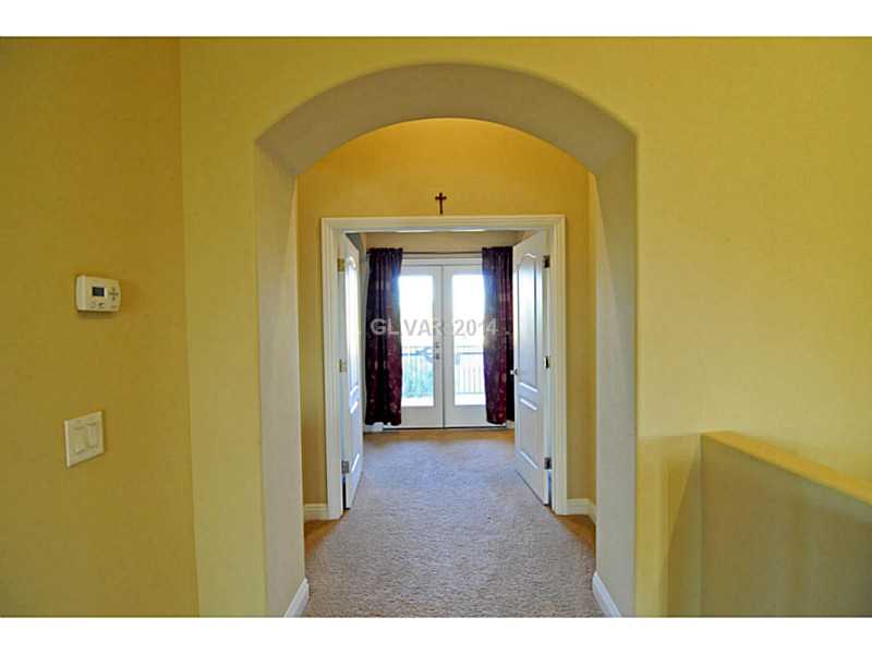 4638 Eel Point Street Las Vegas, NV 89147 - Photo 23 of 30 Other. Hallway to Master balcony, bedroom with retreat and master bathroom