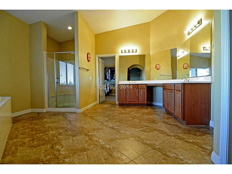 4638 Eel Point Street Las Vegas, NV 89147 - Photo 26 of 30 Master Bath/Spa. Master Bathroom --his/her vanities, shower with bench, sunken tub