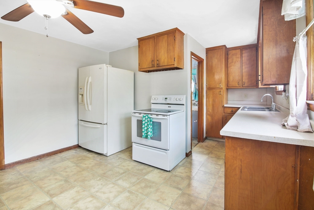 25 North Street Three Rivers, MA 01080 - Photo 5 of 33 a kitchen with stainless steel appliances a refrigerator and a stove