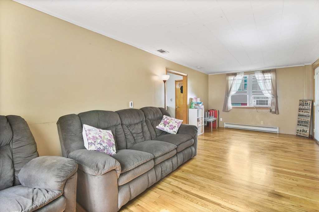 25 North Street Three Rivers, MA 01080 - Photo 7 of 33 a living room with furniture and a wooden floor