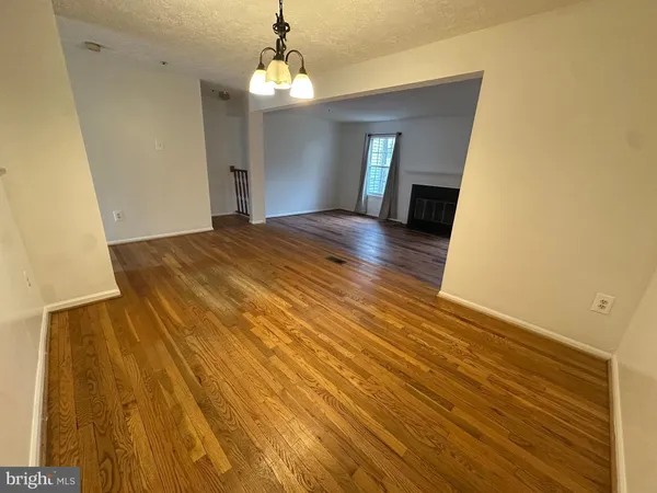 a bedroom with a bed and a mirror on dresser