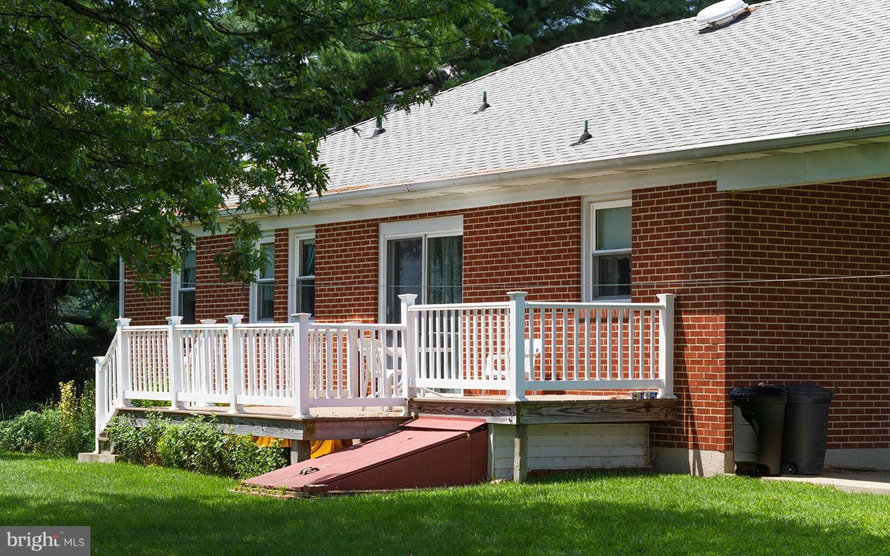 2425 Beckleysville Road Freeland, MD 21053 - Photo 22 of 26 a front view of a house with a garden and yard