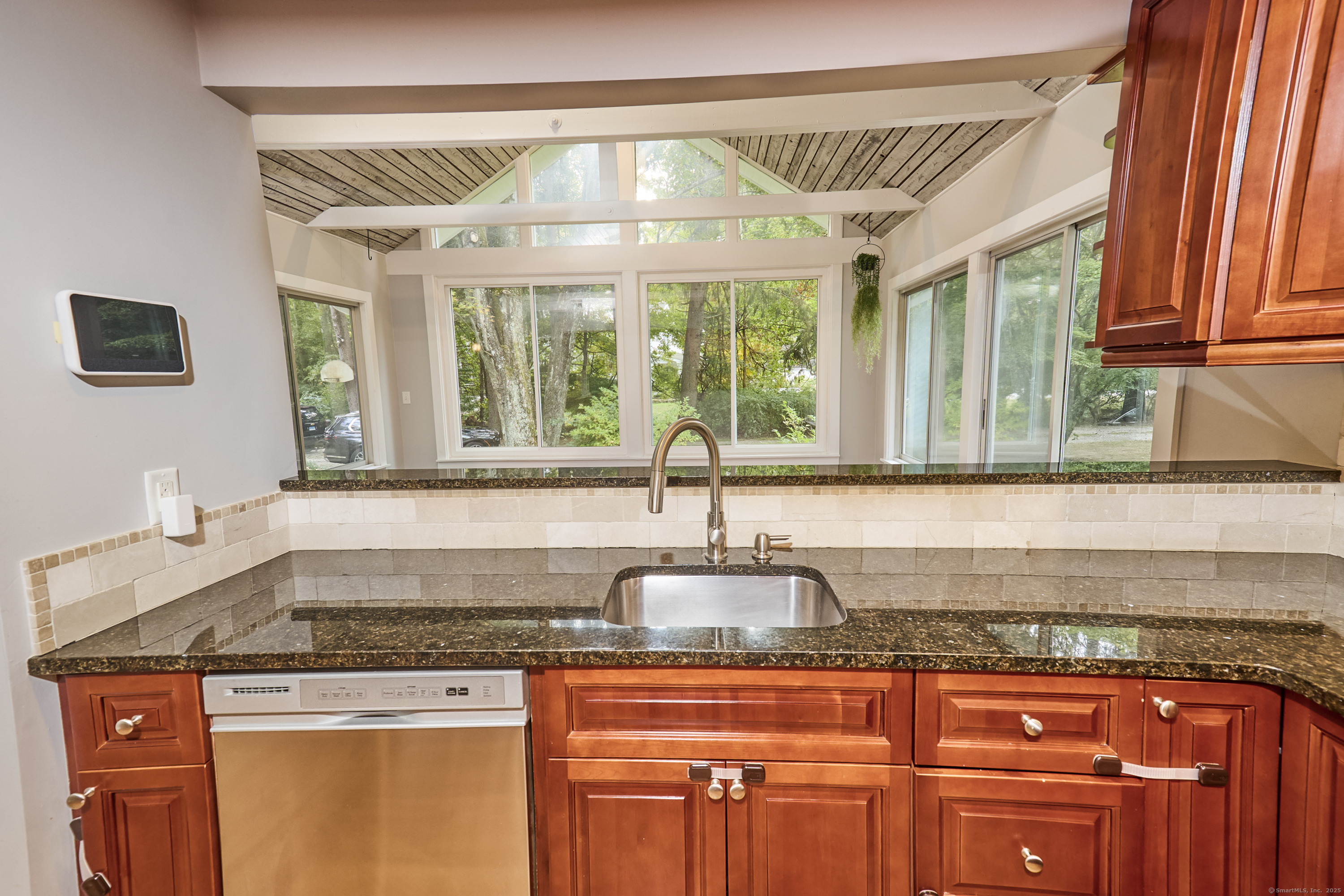 4 Colony Road Weston, CT 06883 - Photo 14 of 39 a kitchen with granite countertop a sink and a window