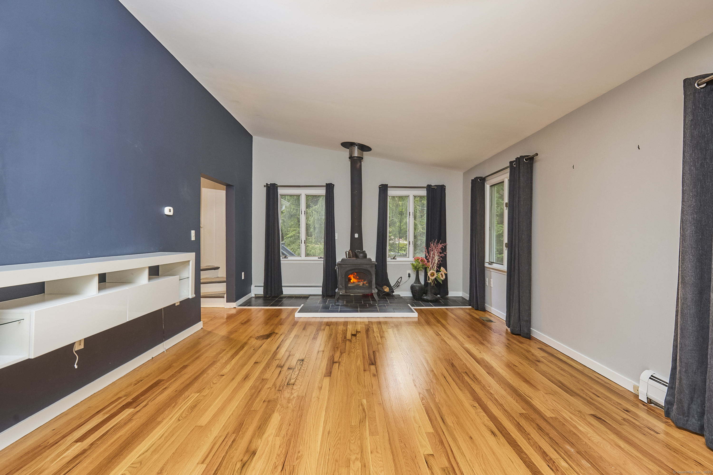 4 Colony Road Weston, CT 06883 - Photo 16 of 39 a view of an empty room with wooden floor and a window