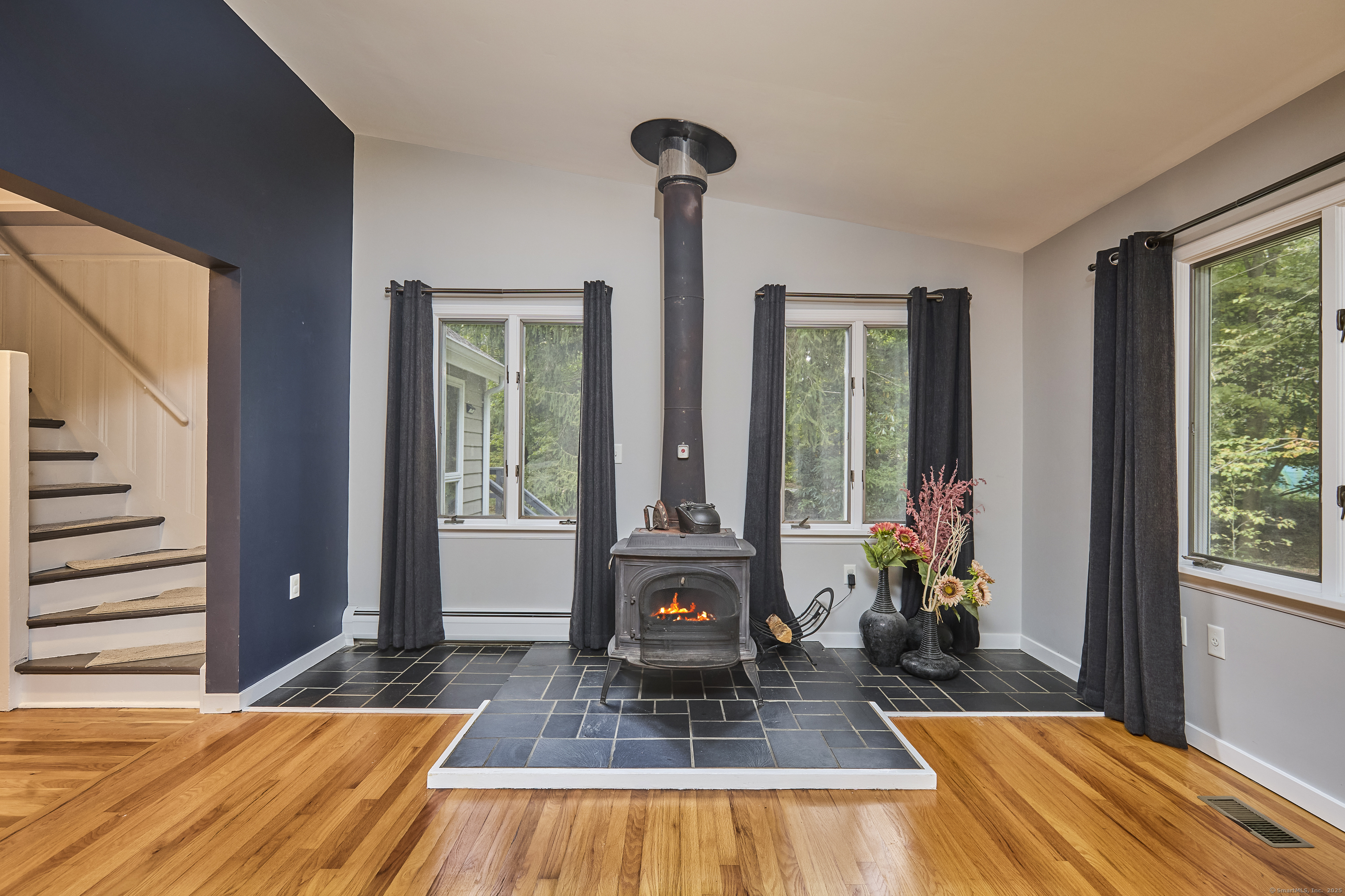 4 Colony Road Weston, CT 06883 - Photo 18 of 39 a living room with furniture and a large window