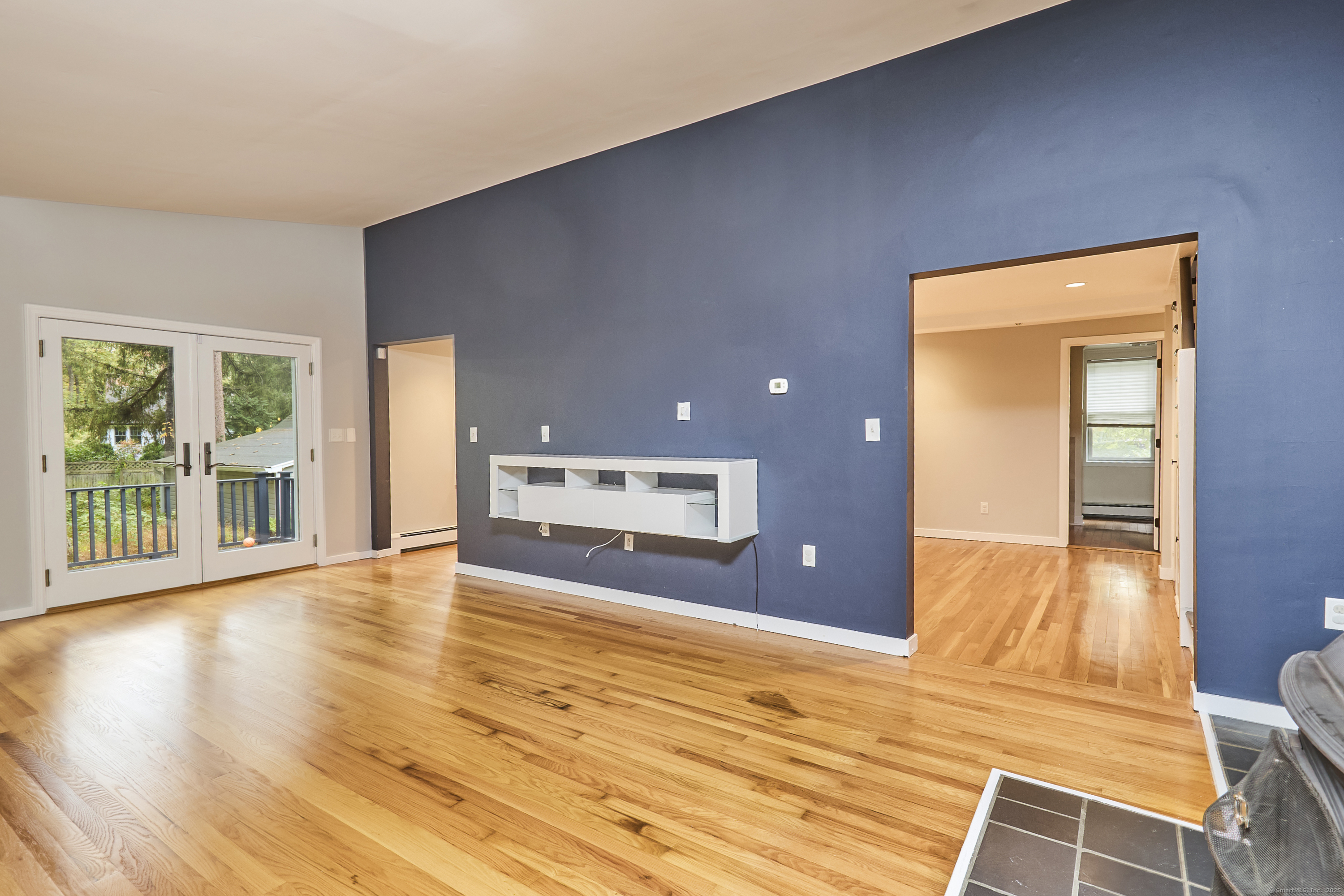 4 Colony Road Weston, CT 06883 - Photo 20 of 39 a view of an empty room with wooden floor and a window