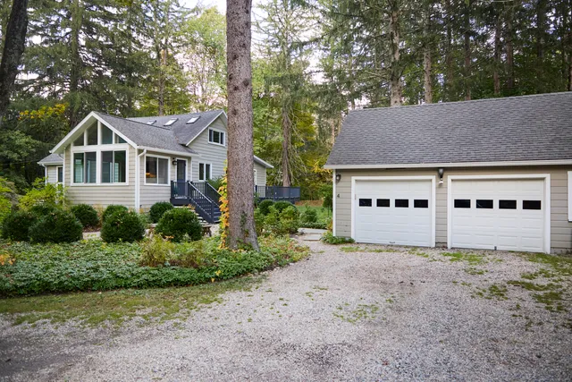 a house that has a tree in front of the house