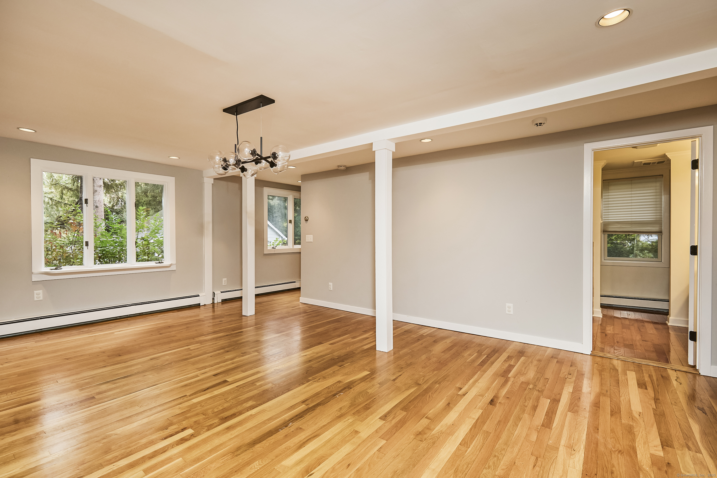 4 Colony Road Weston, CT 06883 - Photo 21 of 39 an empty room with wooden floor cabinet and windows