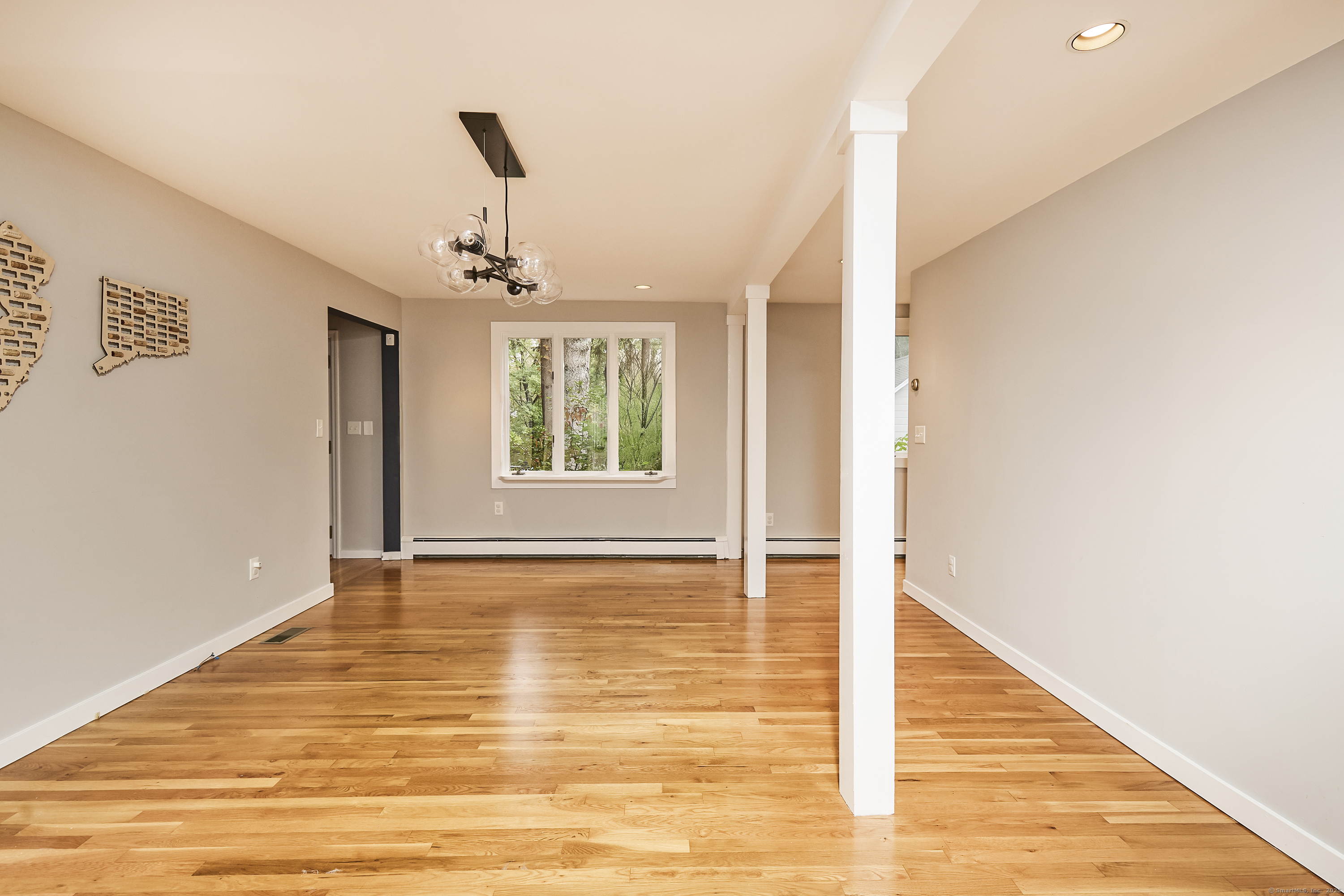 4 Colony Road Weston, CT 06883 - Photo 22 of 39 a view of an empty room with wooden floor and a window