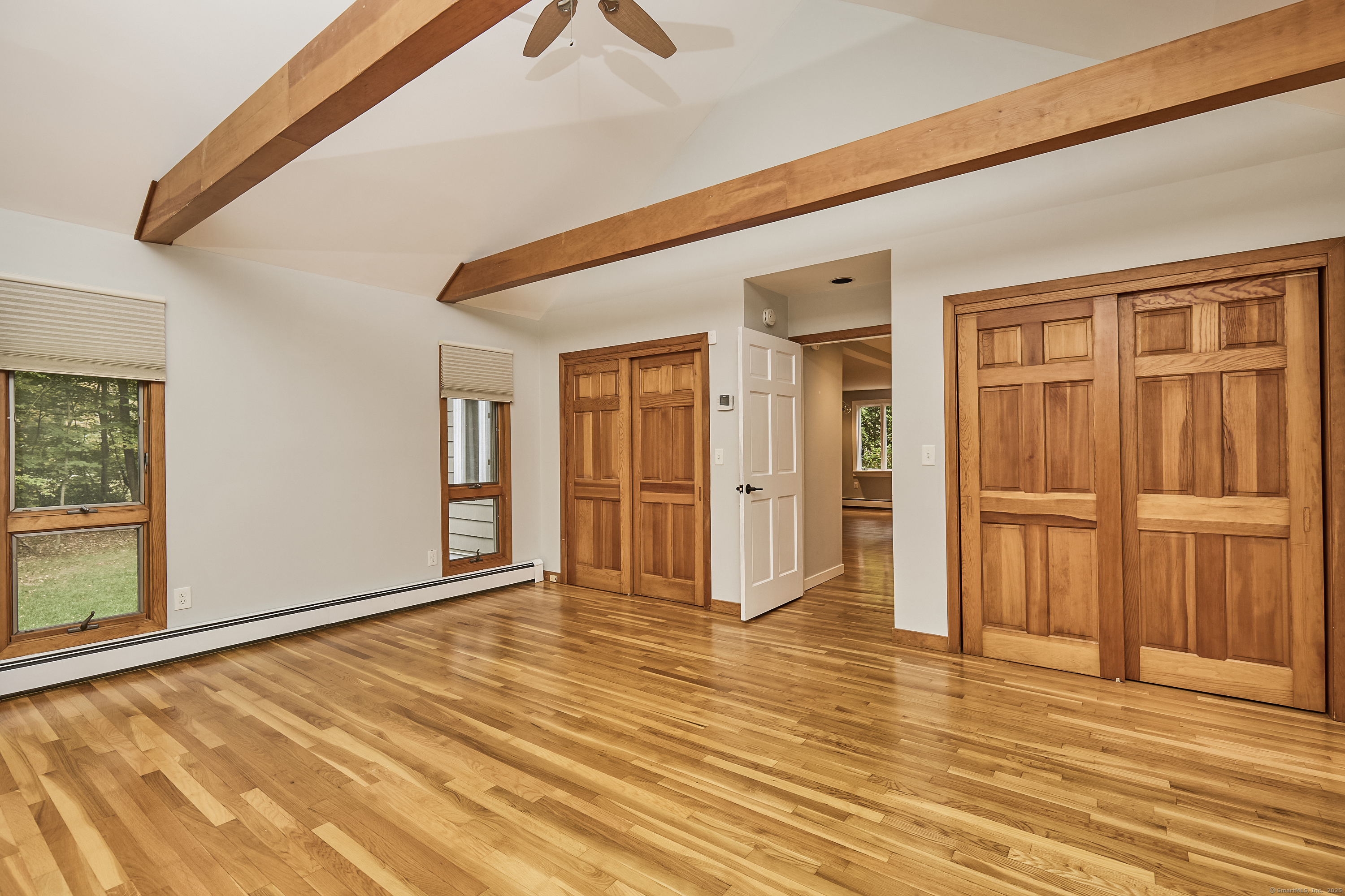 4 Colony Road Weston, CT 06883 - Photo 26 of 39 a view of an empty room with window and wooden floor
