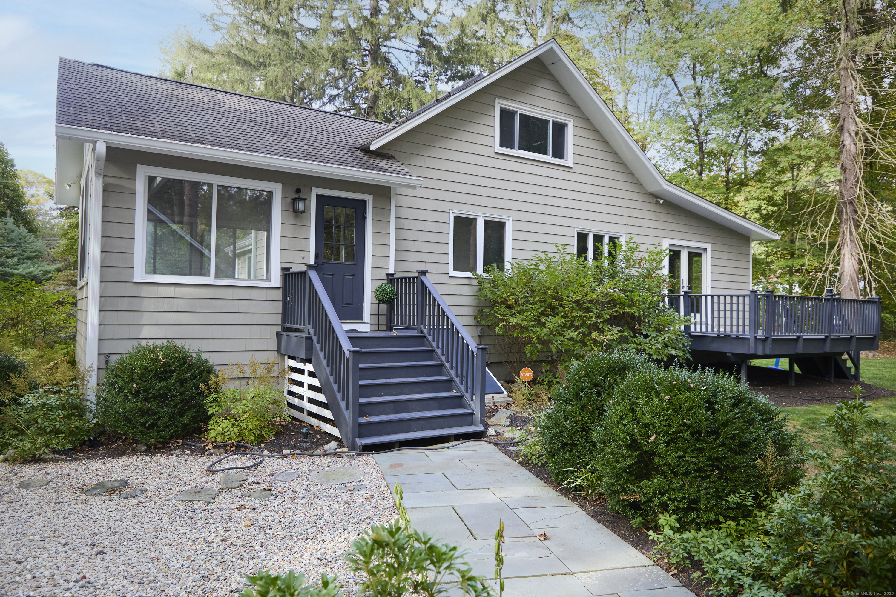 4 Colony Road Weston, CT 06883 - Photo 32 of 39 a view of a house with backyard and wooden fence