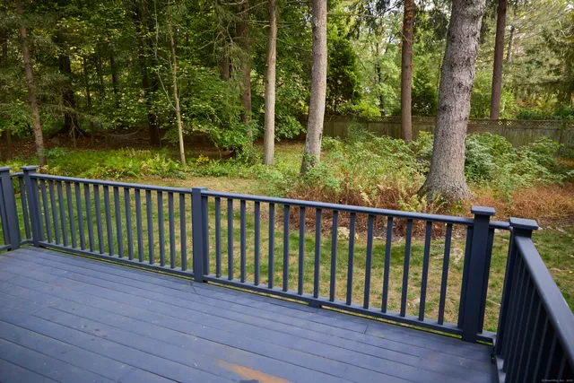 a view of balcony with wooden floor