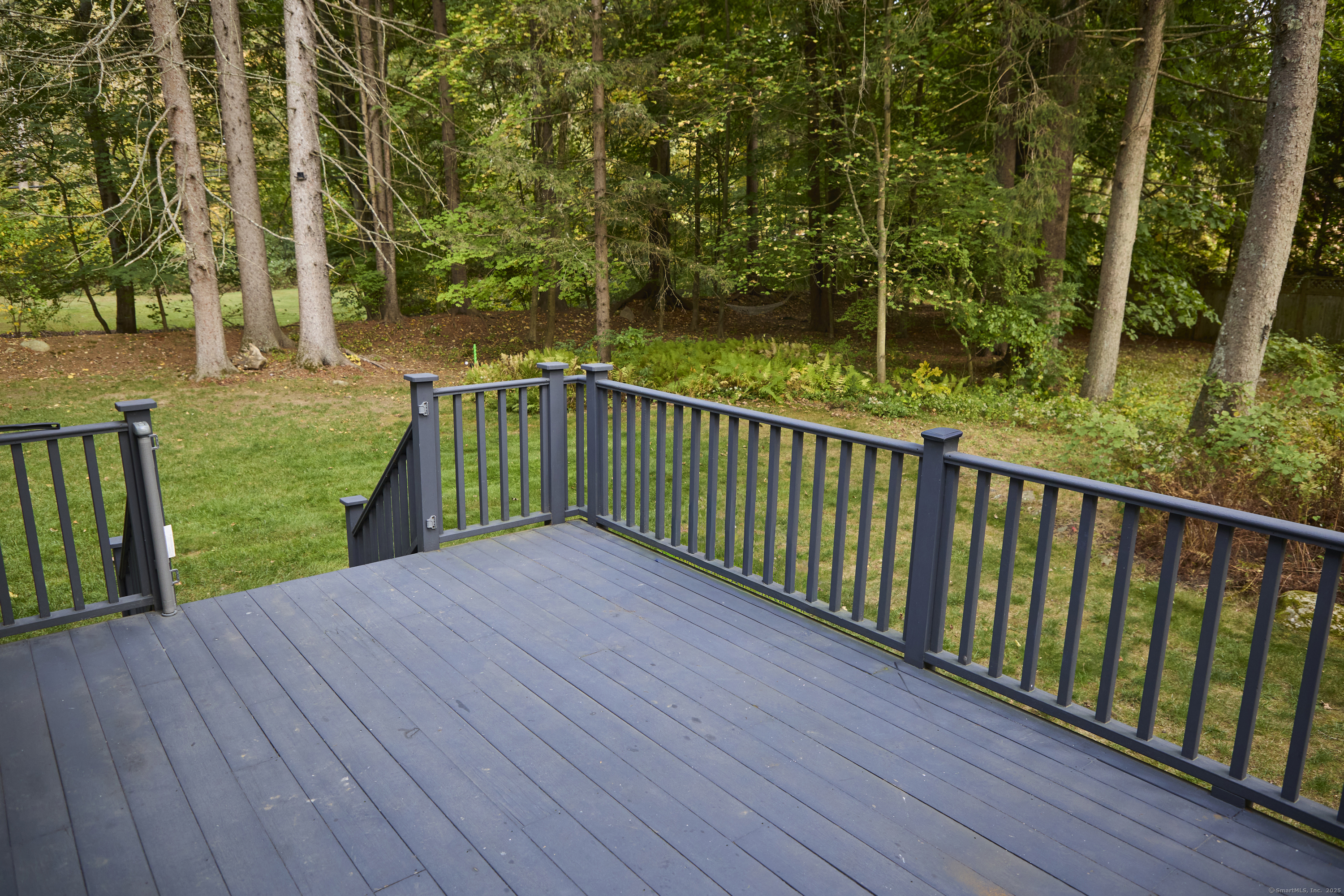 4 Colony Road Weston, CT 06883 - Photo 34 of 39 a view of deck with wooden floor and fence