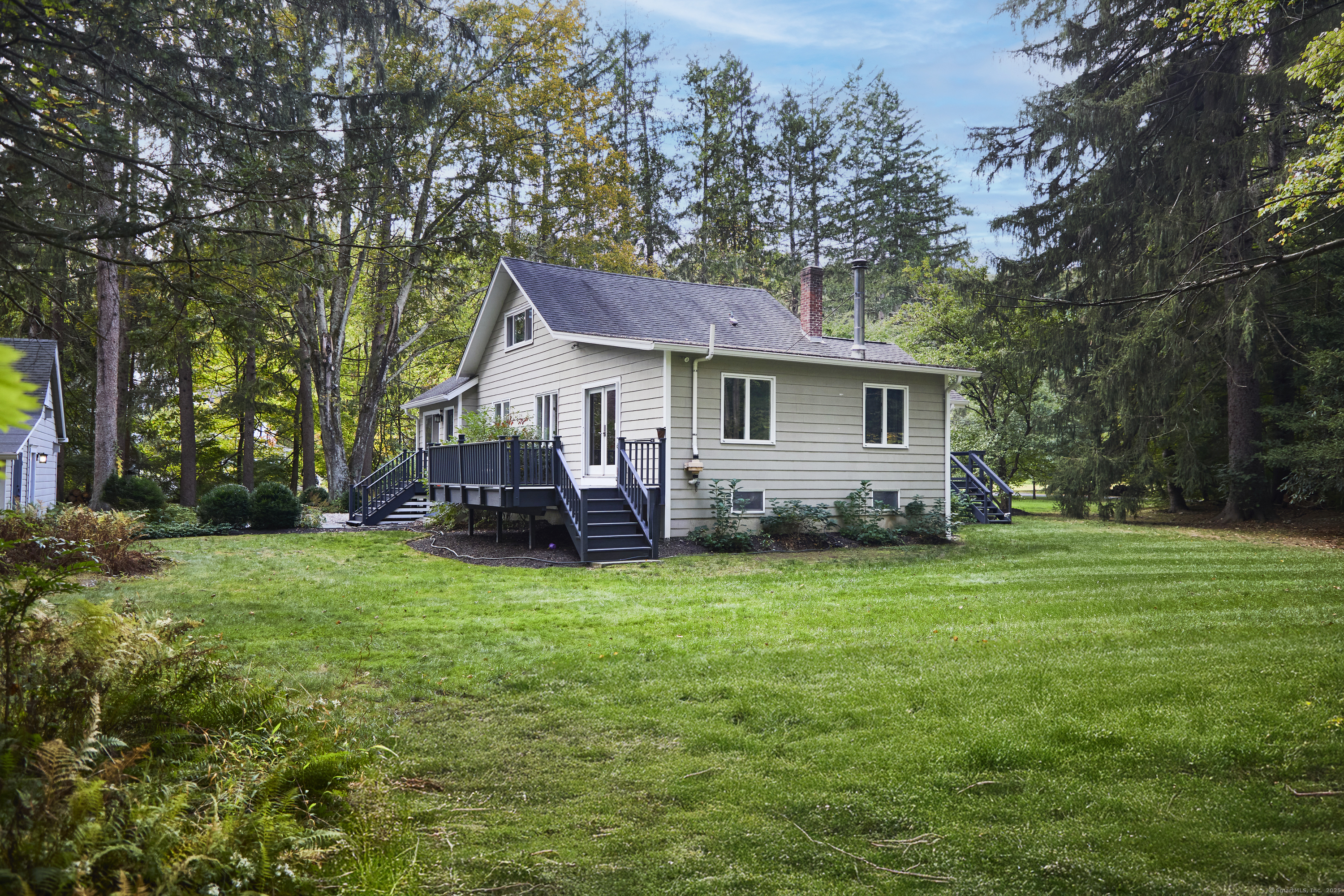 4 Colony Road Weston, CT 06883 - Photo 35 of 39 a house view with a garden space