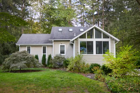 a front view of a house with a yard