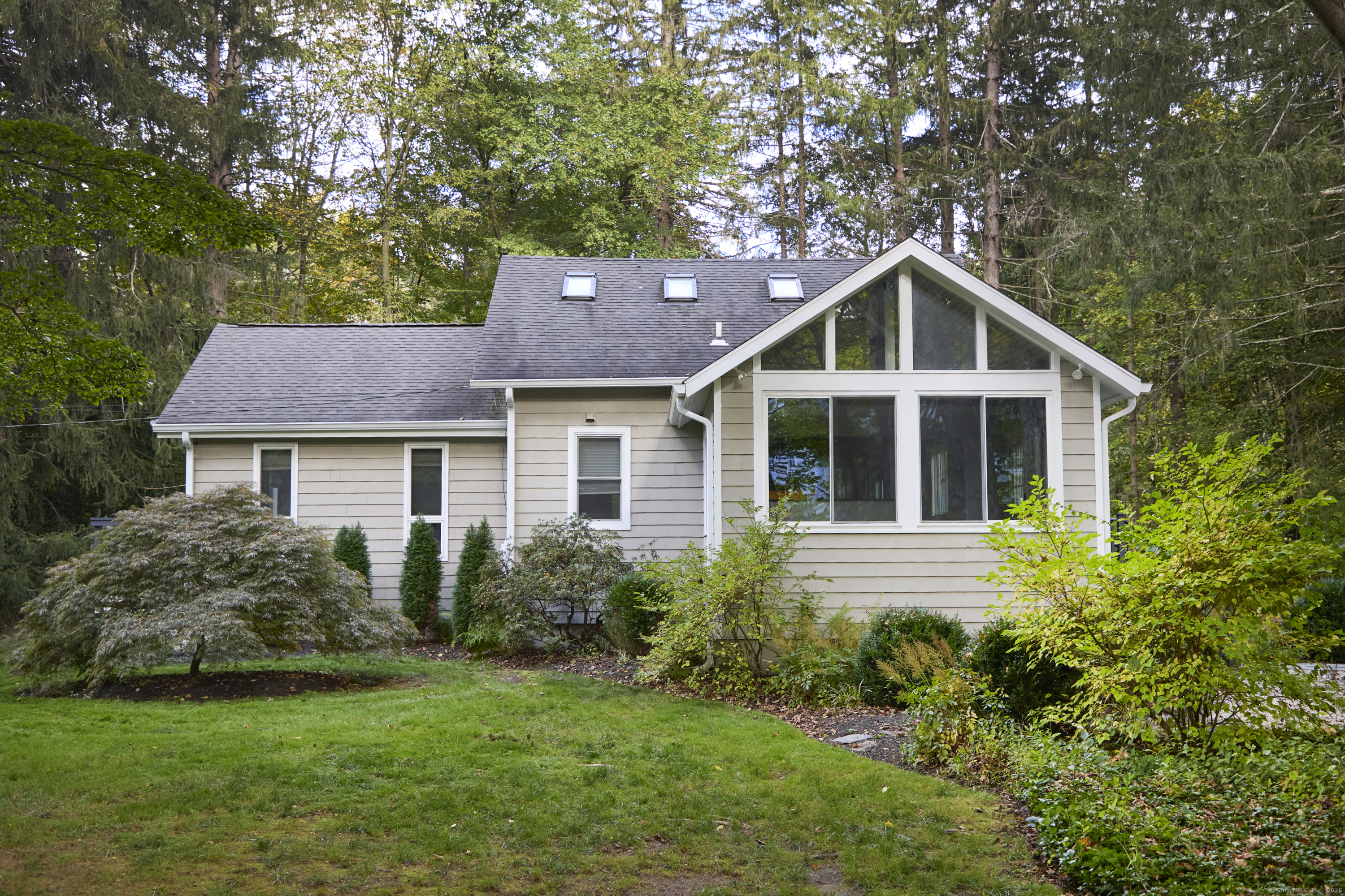 4 Colony Road Weston, CT 06883 - Photo 37 of 39 a front view of a house with a yard