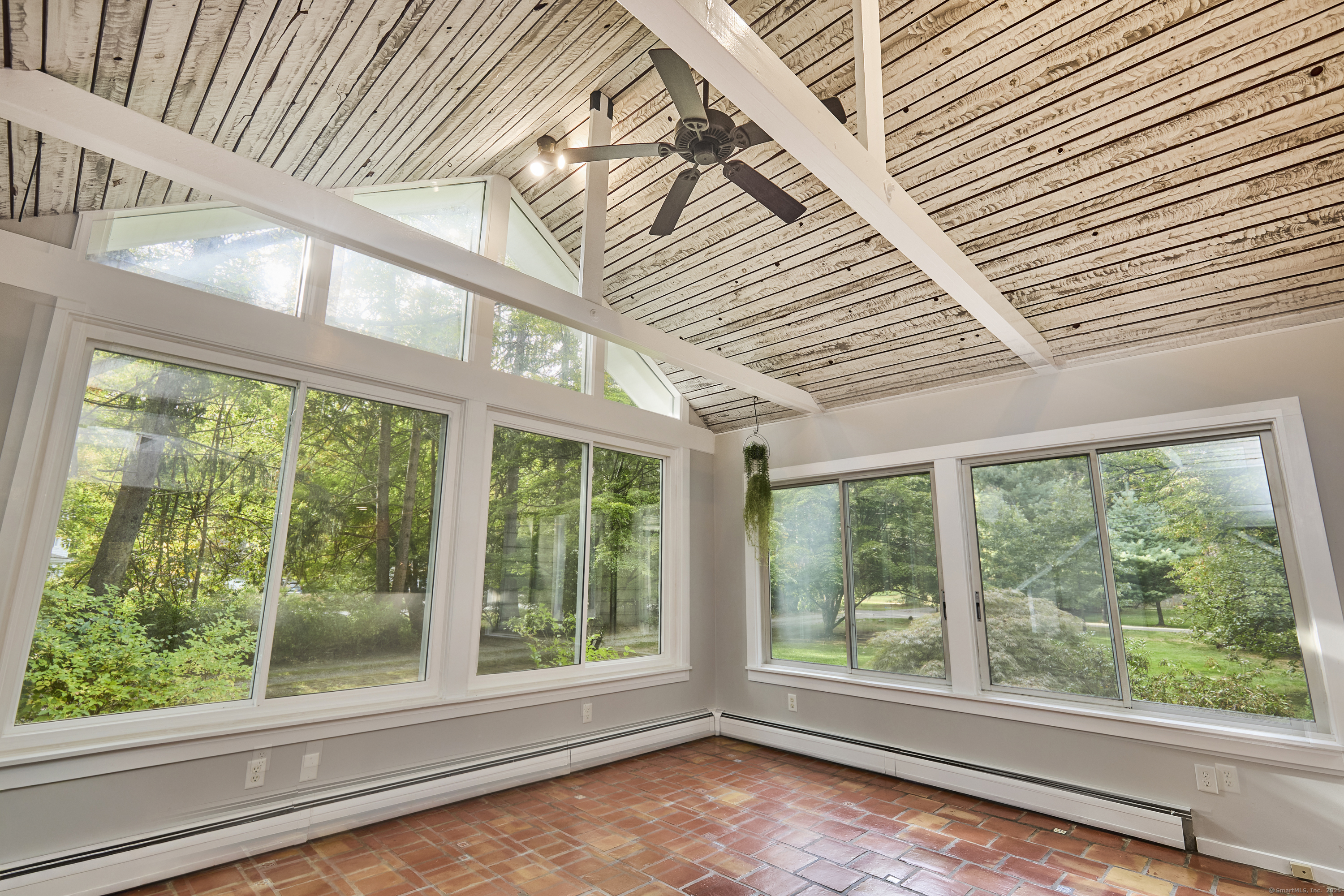 4 Colony Road Weston, CT 06883 - Photo 4 of 39 a view of empty room with large windows