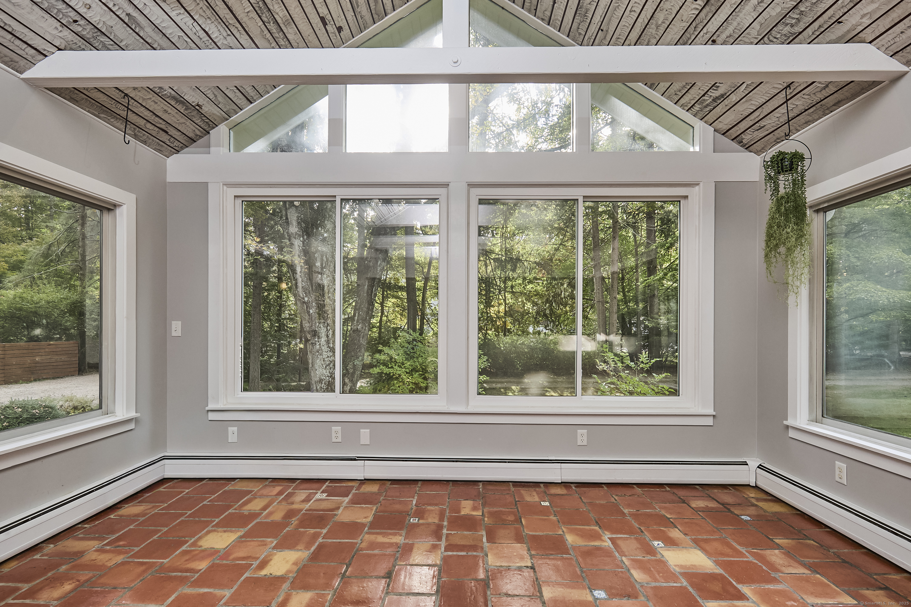 4 Colony Road Weston, CT 06883 - Photo 7 of 39 a view of empty room with large windows