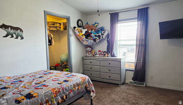 401 West 2000th Street South Vernal, UT 84078 - Photo 16 of 26 Bedroom featuring carpeted flooring and a window with horizontal blinds and drapes
