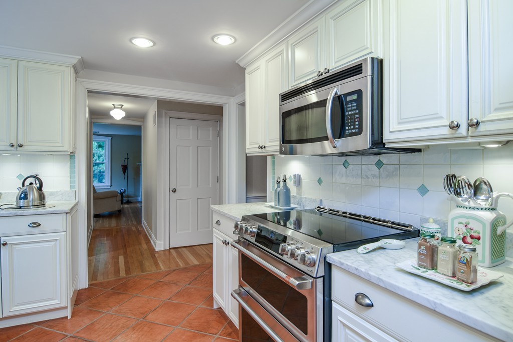 16 Tower Drive Dover, MA 02030 - Photo 11 of 42 a kitchen with a stove and a microwave