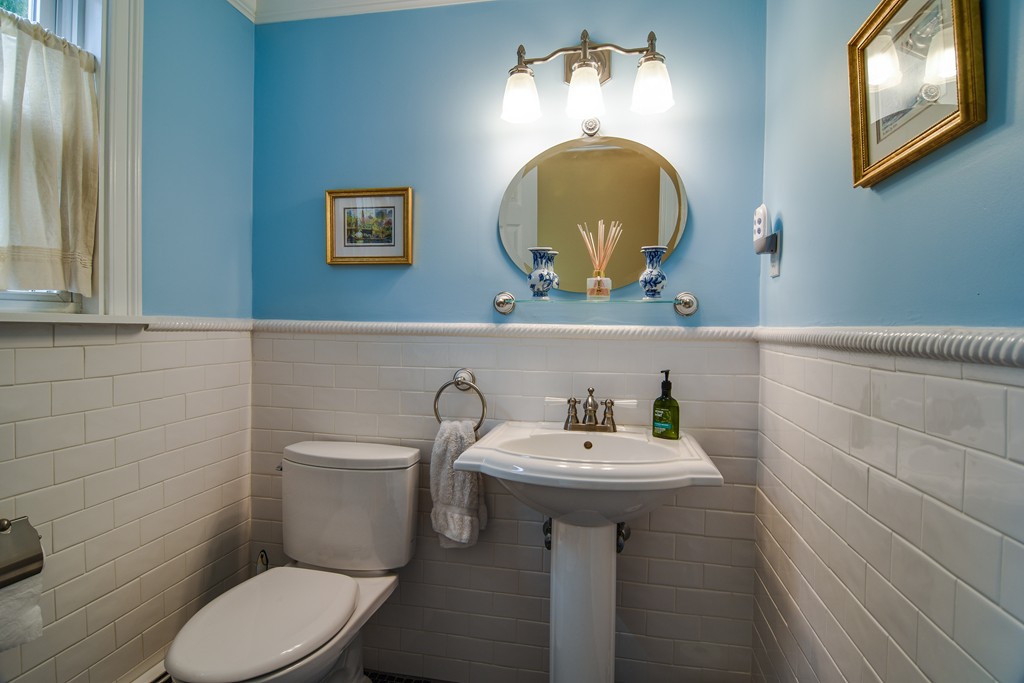 16 Tower Drive Dover, MA 02030 - Photo 19 of 42 a bathroom with a sink a mirror and toilet
