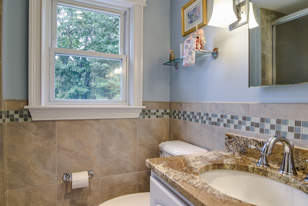 16 Tower Drive Dover, MA 02030 - Photo 22 of 42 a bathroom with a granite countertop sink and a mirror