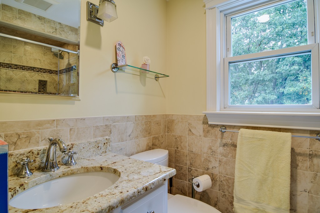 16 Tower Drive Dover, MA 02030 - Photo 24 of 42 a bathroom with a granite countertop sink a toilet and shower