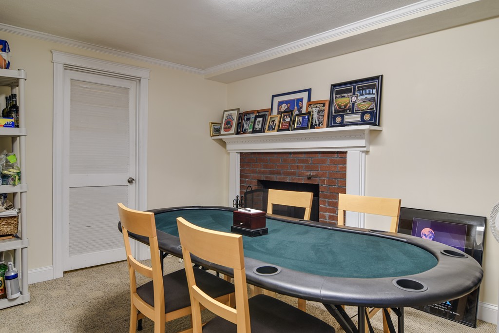 16 Tower Drive Dover, MA 02030 - Photo 26 of 42 a living room with chairs and a fireplace