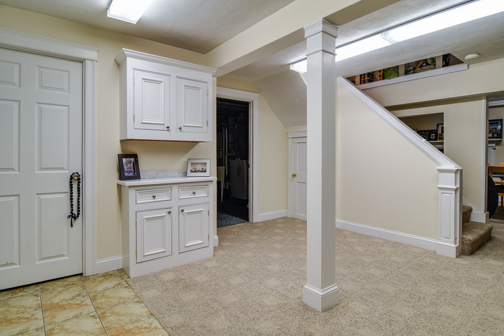 16 Tower Drive Dover, MA 02030 - Photo 27 of 42 a kitchen with white cabinets and sink
