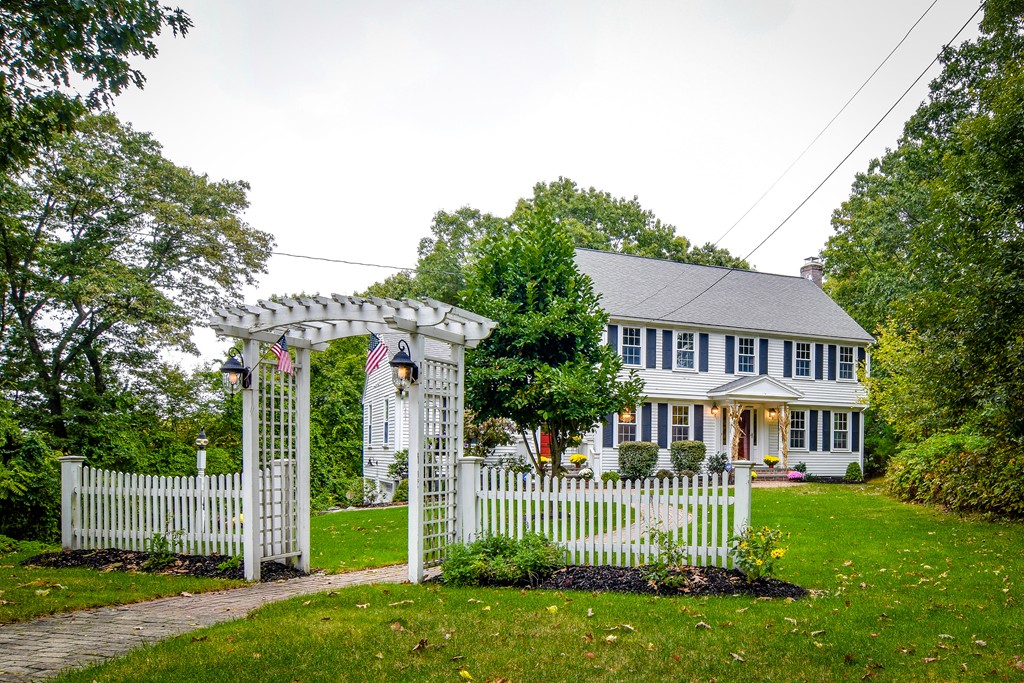 16 Tower Drive Dover, MA 02030 - Photo 28 of 42 a front view of a house with a garden