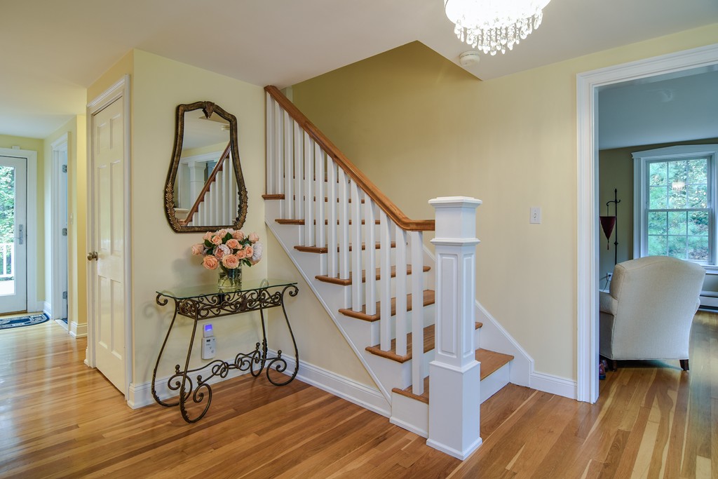 16 Tower Drive Dover, MA 02030 - Photo 3 of 42 a view of entryway with wooden floor and stairs
