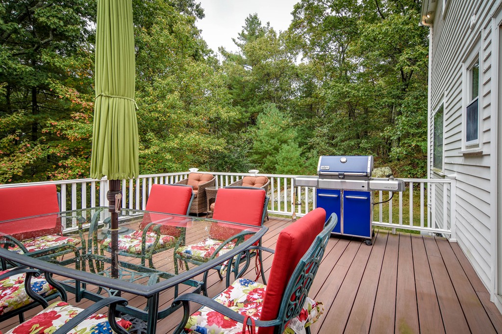 16 Tower Drive Dover, MA 02030 - Photo 31 of 42 a balcony with wooden floor table and chairs