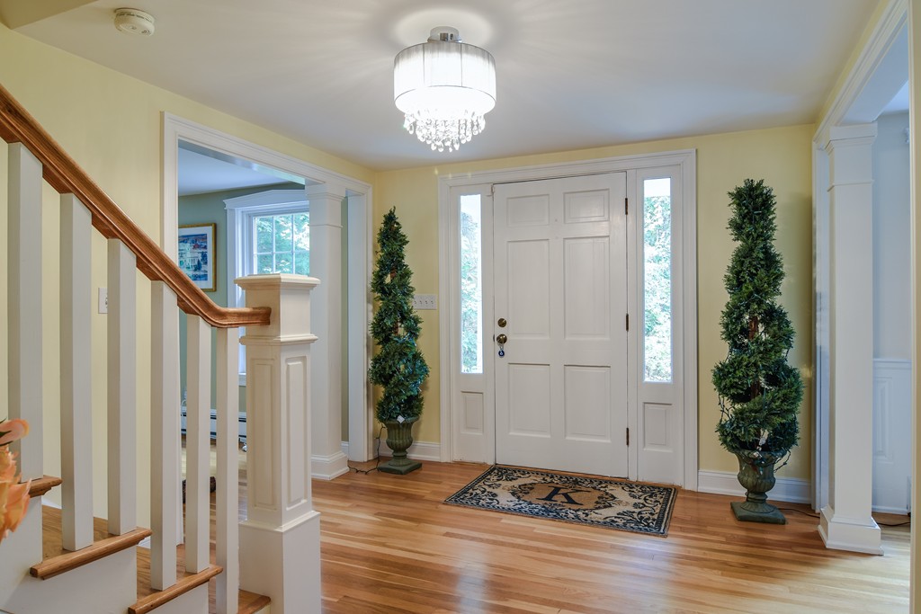 16 Tower Drive Dover, MA 02030 - Photo 4 of 42 a view of entryway with wooden floor and stairs
