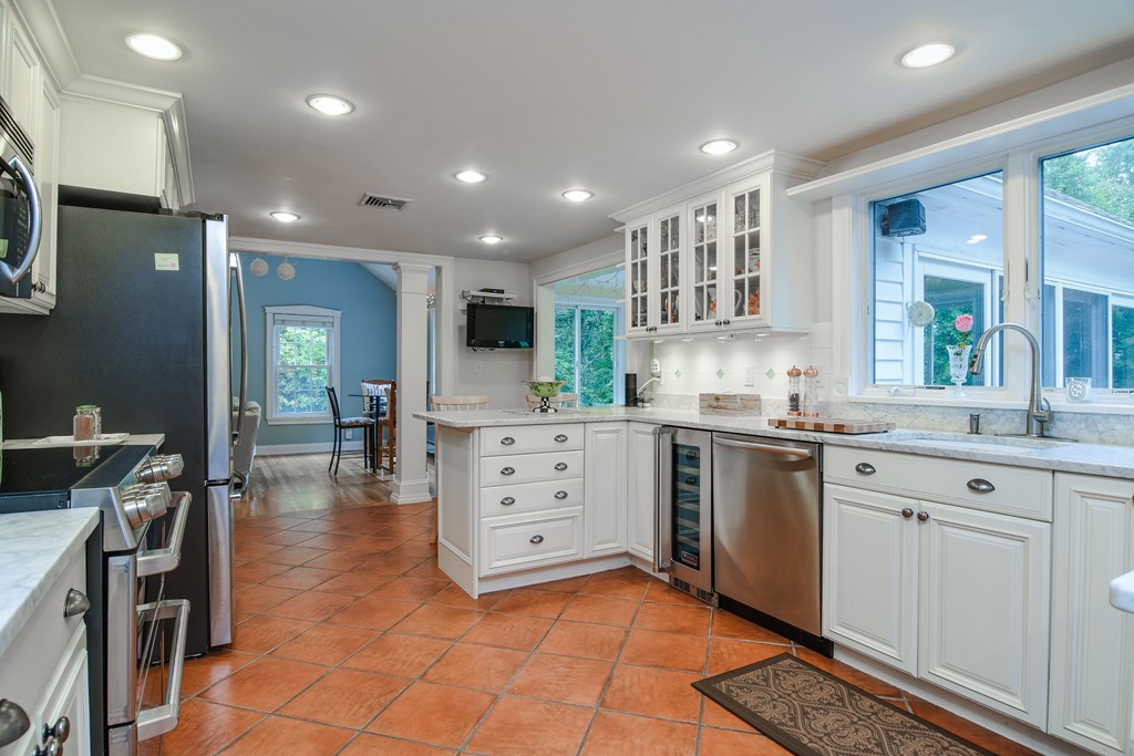 16 Tower Drive Dover, MA 02030 - Photo 9 of 42 a kitchen with white cabinets and sink