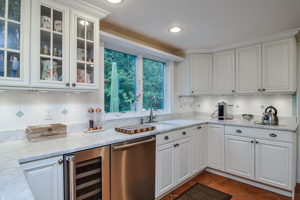 16 Tower Drive Dover, MA 02030 - Photo 10 of 42 a kitchen with stainless steel appliances granite countertop white cabinets sink and window
